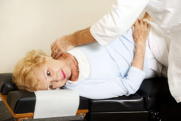image of woman getting chiropractic adjustment