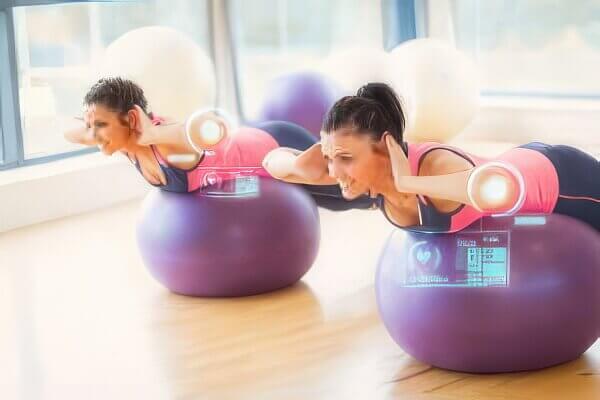 image of couple using exercise balls