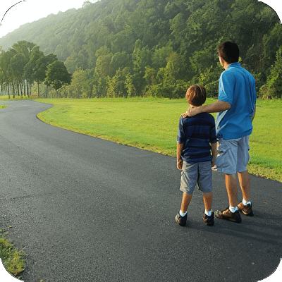 image of man and child walking together