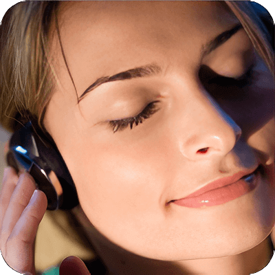 image of woman listening to headphones