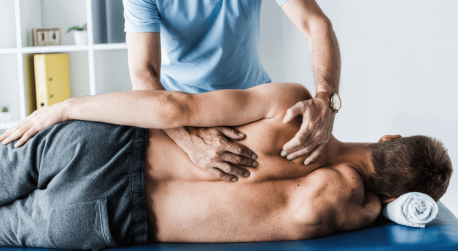 Man receives chiropractic adjustment