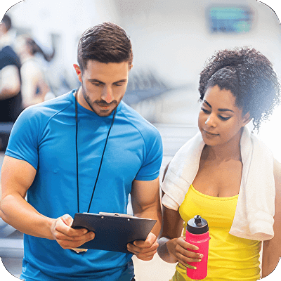 image of woman working with a personal trainer.